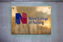 A plaque with the Royal College of Nursing emblem.