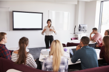 People in a classroom having a lesson.
