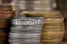 Coins with funding written on them