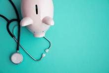 Piggy bank and stethoscope