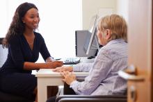 GP and a patient in a doctor's surgery.