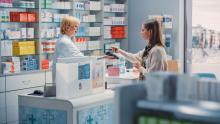 Woman being served by pharmacist