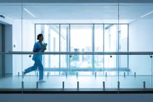 doctor running through hospital corridor