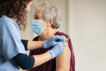 Old woman getting vaccine