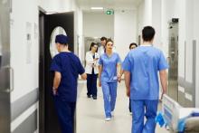 Doctors walking through hospital corridor