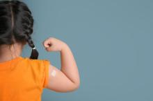 Child with a plaster on their arm