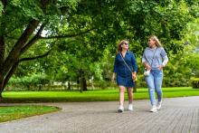 Two women walking in the park