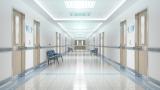 A hospital corridor with lots of doors.