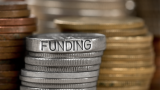 Coins with funding written on them