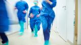 Surgeons running to help a patient in a hospital