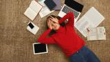 Girl stressed with books and laptop