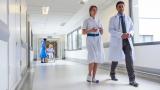 Doctors walking down hospital corridor