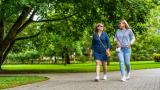 Two women walking in the park
