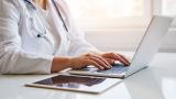 Doctor on computer