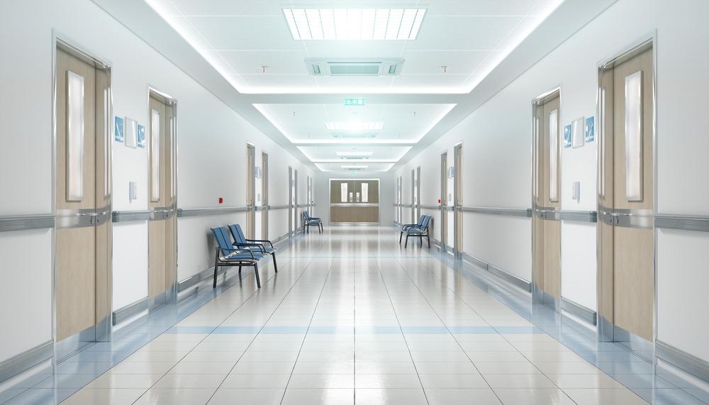 A hospital corridor with lots of doors.