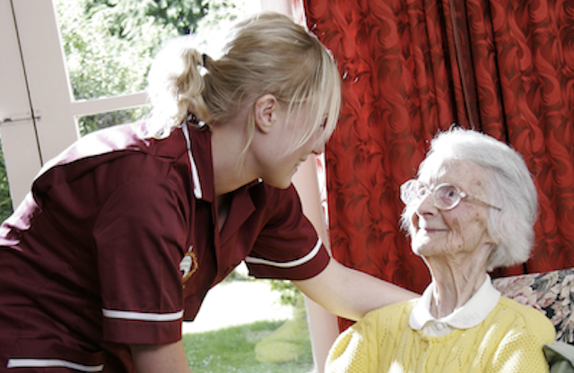 A carer looking after a patient