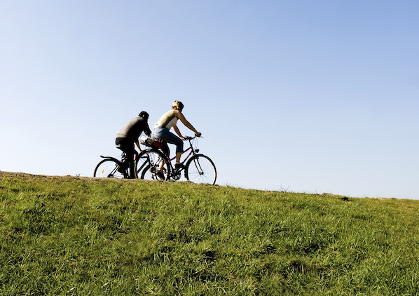 Two people cycling