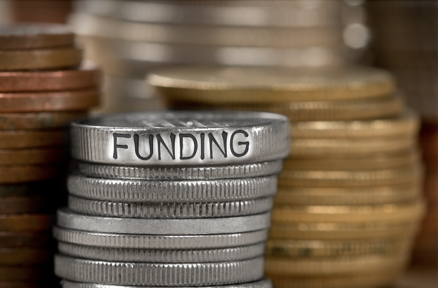 Coins with funding written on them