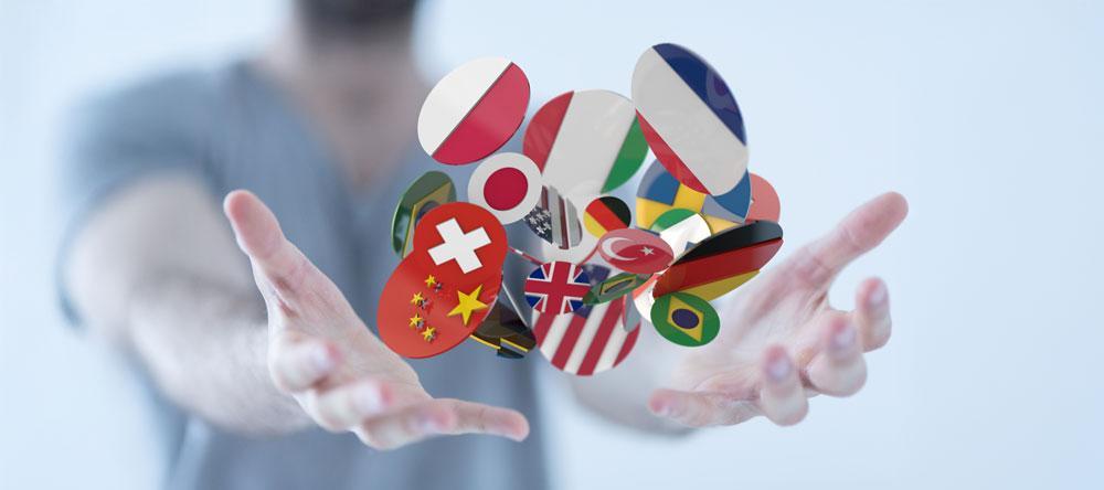 Multilingual concept art of person holding many countries' flags