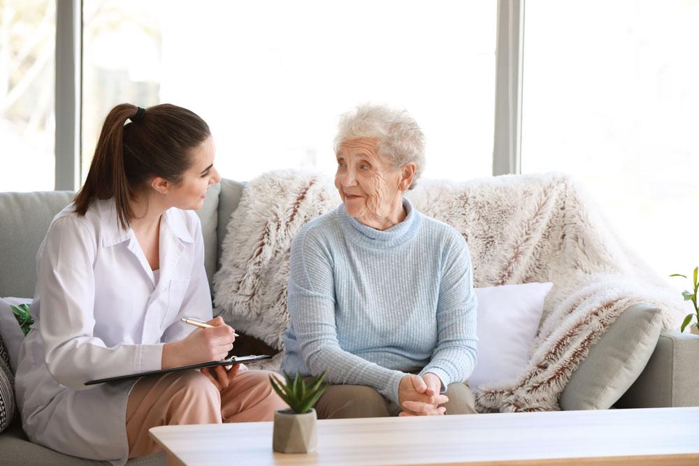 Doctor speaking to elderly woman