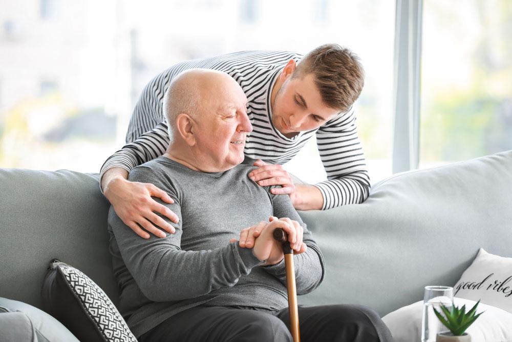Unpaid carer with older man