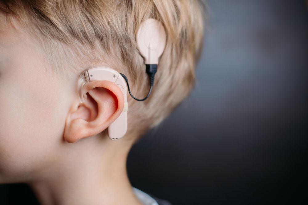 Young boy with cochlear implant