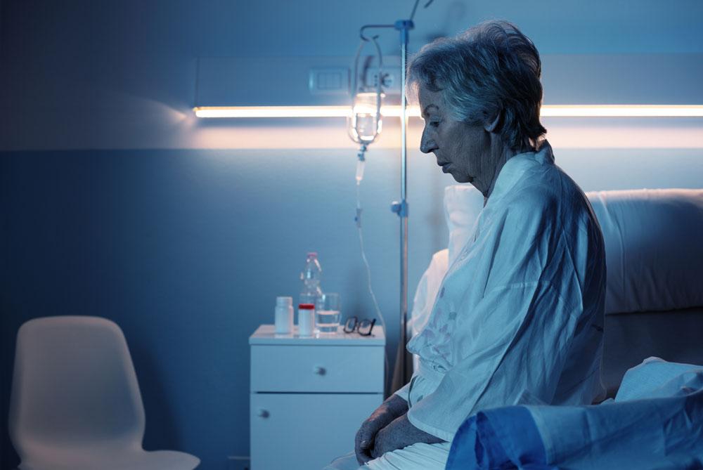 Old woman in hospital at night