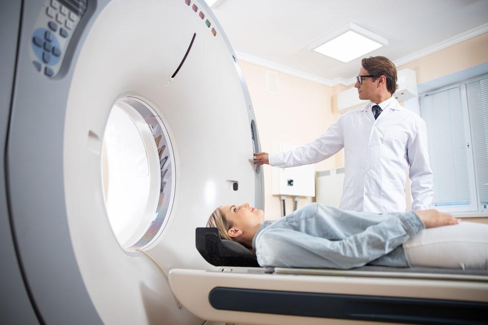 Young woman having a CT scan