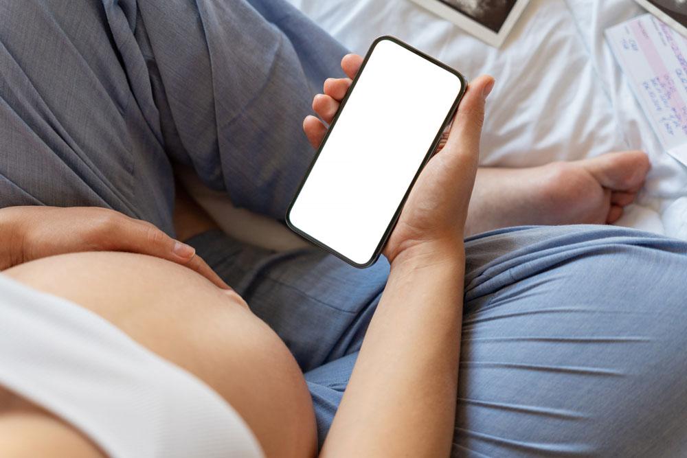 Pregnant woman on phone